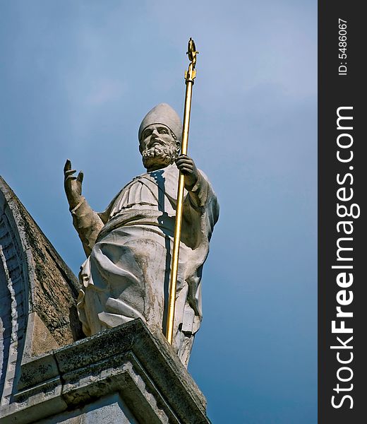 Statue of saint on a antique church