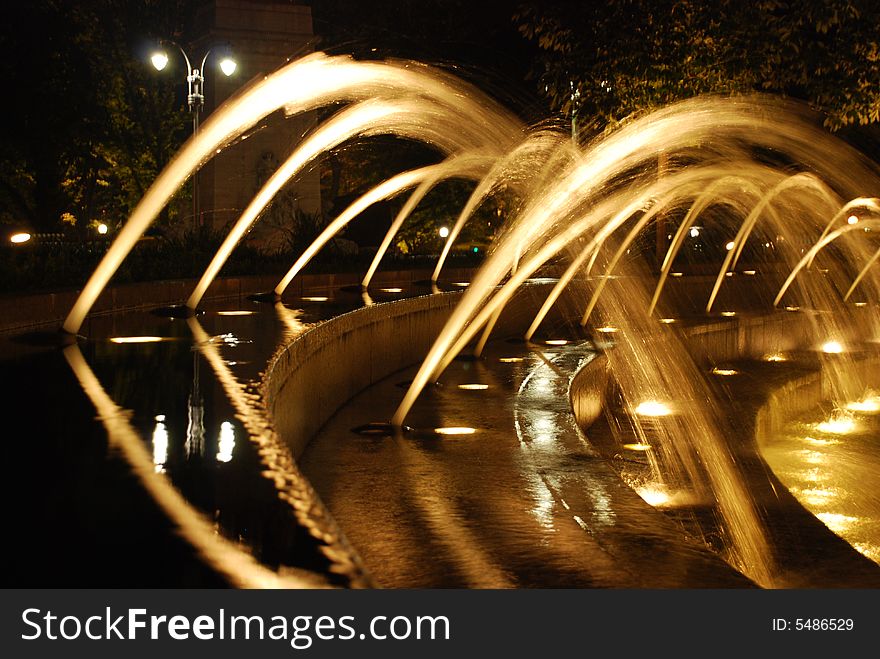 Night shot, slow shutter speed to blur the water jets. new york, summer night. near central park. Night shot, slow shutter speed to blur the water jets. new york, summer night. near central park