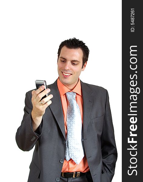 A young businessman, holding a touch screen cellphone(mobile) in his hand, smiling. A young businessman, holding a touch screen cellphone(mobile) in his hand, smiling