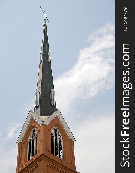 Looking up at an old brick church steeple. Looking up at an old brick church steeple