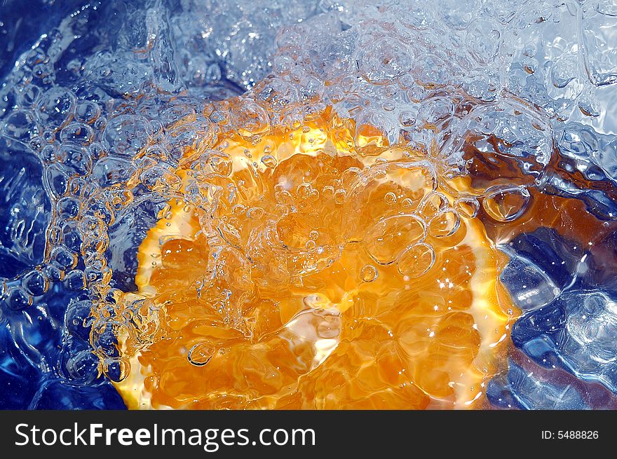 Fresh orange in the water