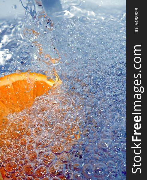 Fresh orange in the water