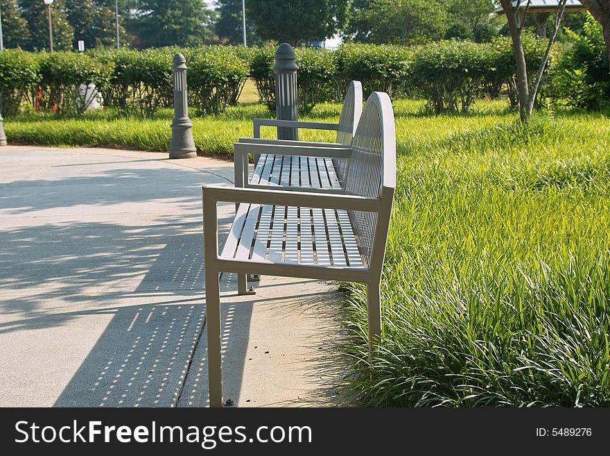 Park benches situated in a beautifully landscaped park.