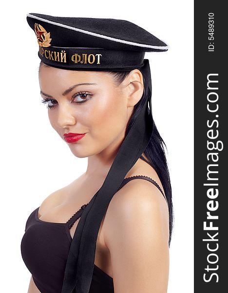 Seductive brunette wearing Russian sailor's cap. Black sea fleet on the cap. Seductive brunette wearing Russian sailor's cap. Black sea fleet on the cap.
