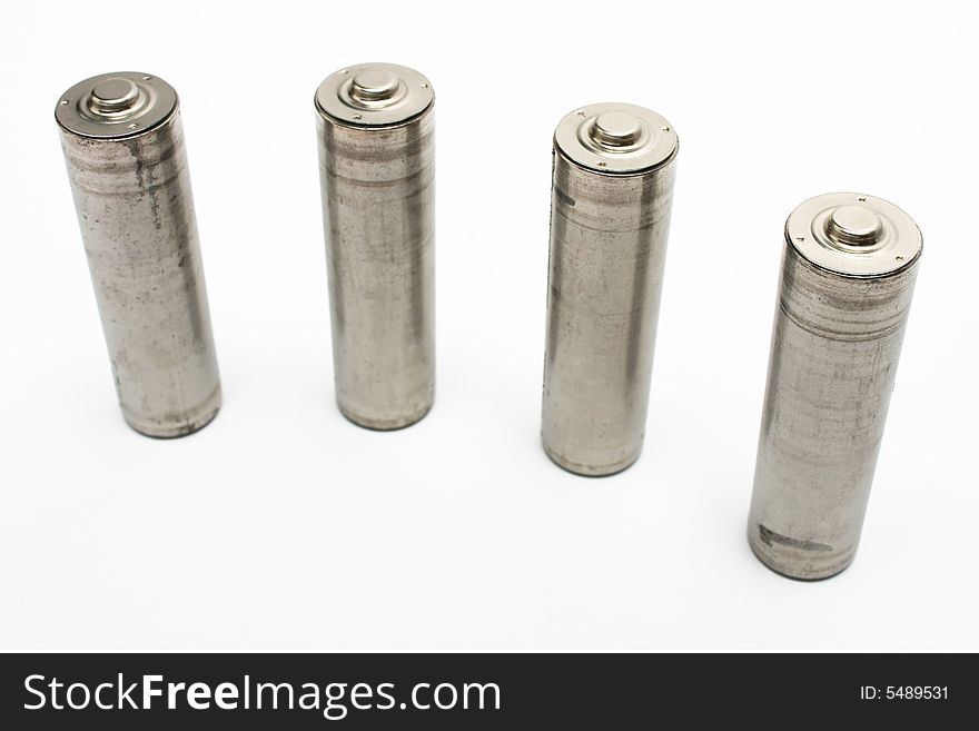 Four AA size battery standing on white background. Four AA size battery standing on white background.