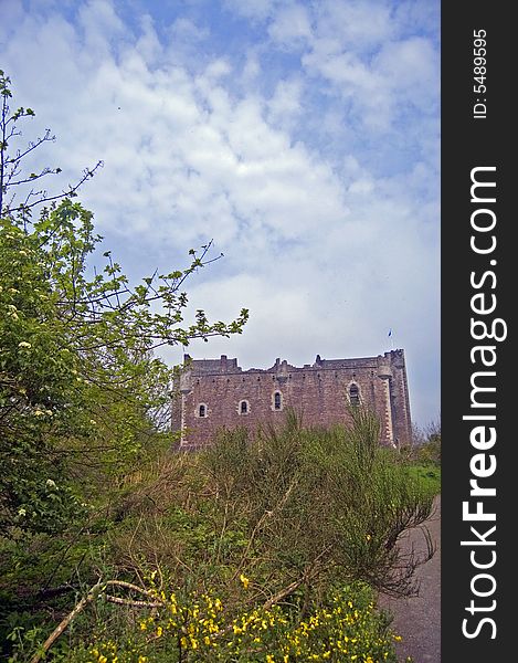 A view of doune castle and trees at doune
in scotland in the united kingdom. A view of doune castle and trees at doune
in scotland in the united kingdom