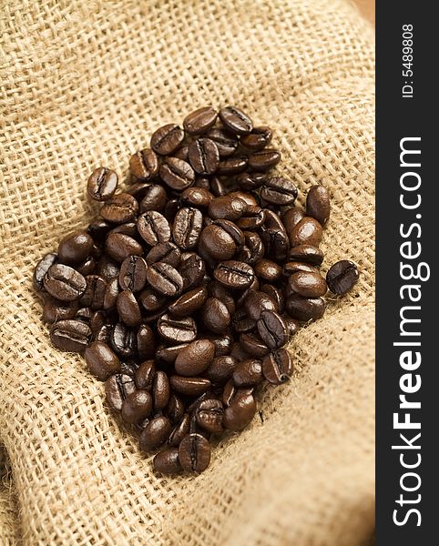 High quality roasted coffee beans on burlap