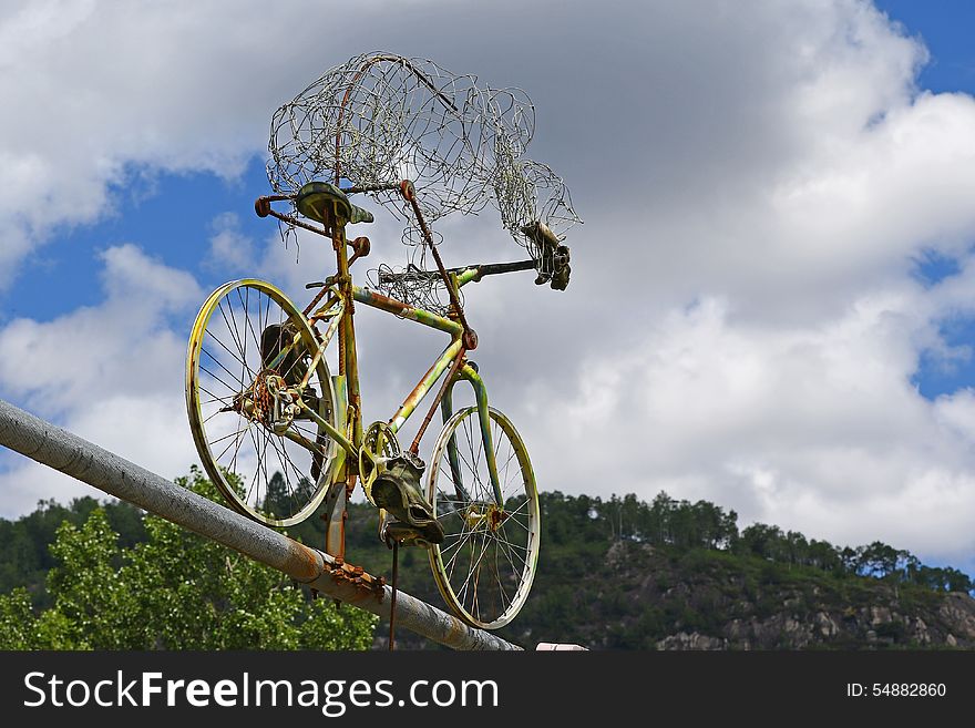 Old bicycle placed on a suspension bridge