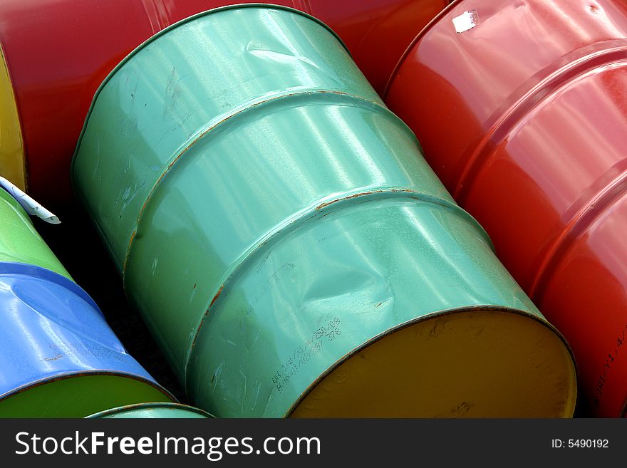 Barrels in different coors packed on a ship