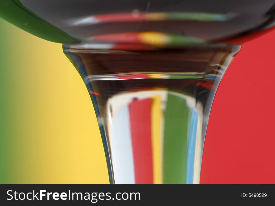 A glass with a simple green - yellow - red color background. A glass with a simple green - yellow - red color background