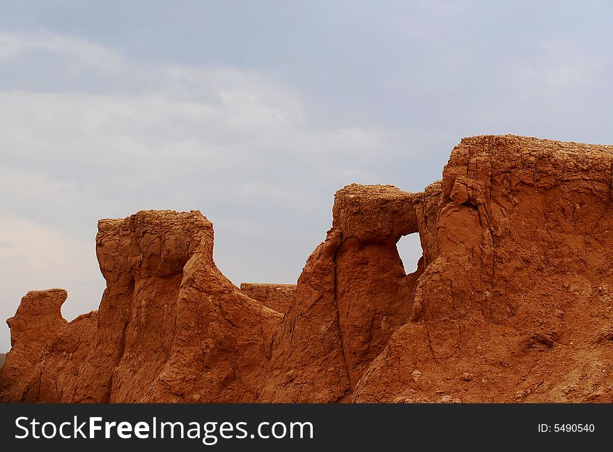 Weather-blown sandstone at the Flaming Cliffs, the northern Gobi Desert, in Mongolia. Weather-blown sandstone at the Flaming Cliffs, the northern Gobi Desert, in Mongolia