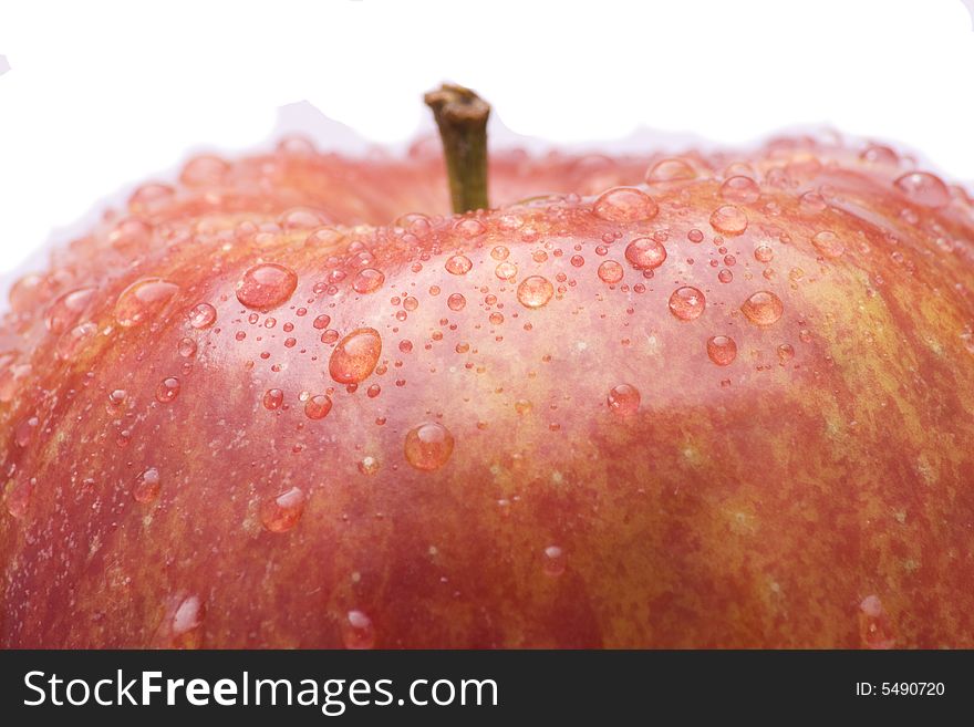 Red apple with water drops on white background