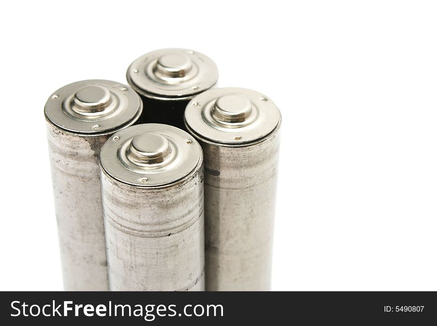 Close of four AA size batteries on white background. Close of four AA size batteries on white background.