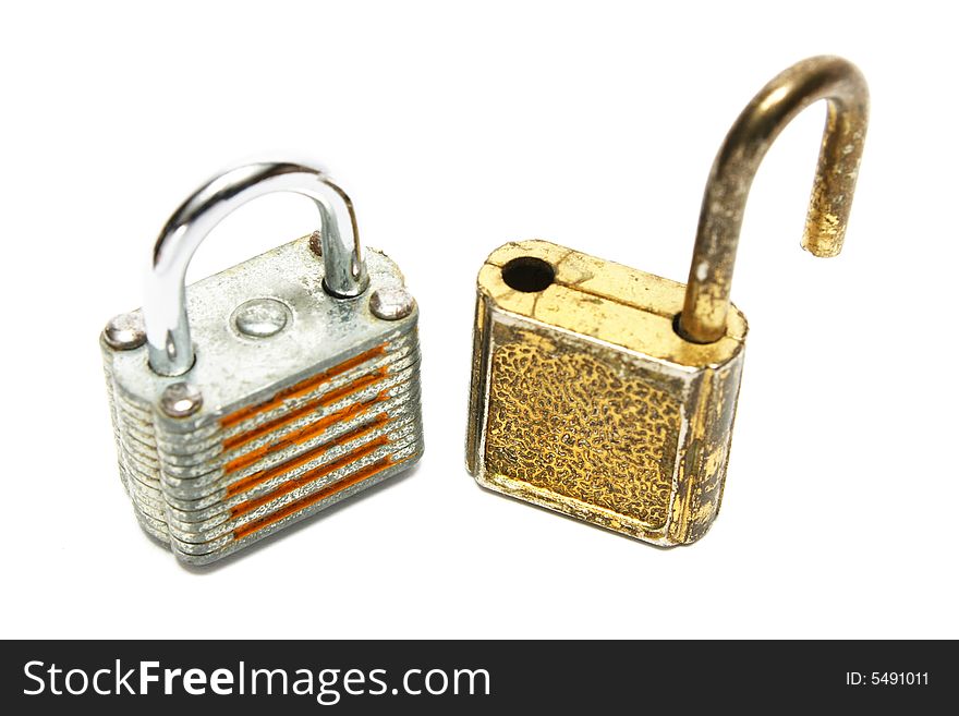 Two rusty locks standing on white background.
