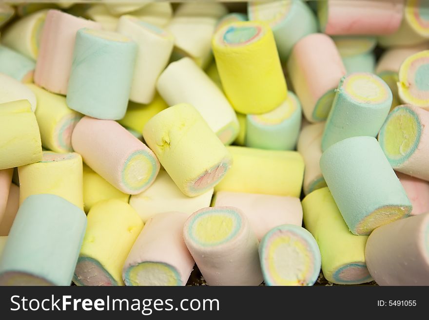 A photo of multi-colored marshmallow pile