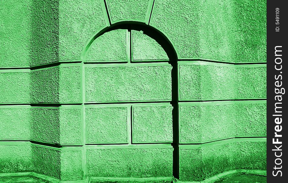 Foundation of building from the concrete blocks of green color with the decorative arch. Foundation of building from the concrete blocks of green color with the decorative arch.