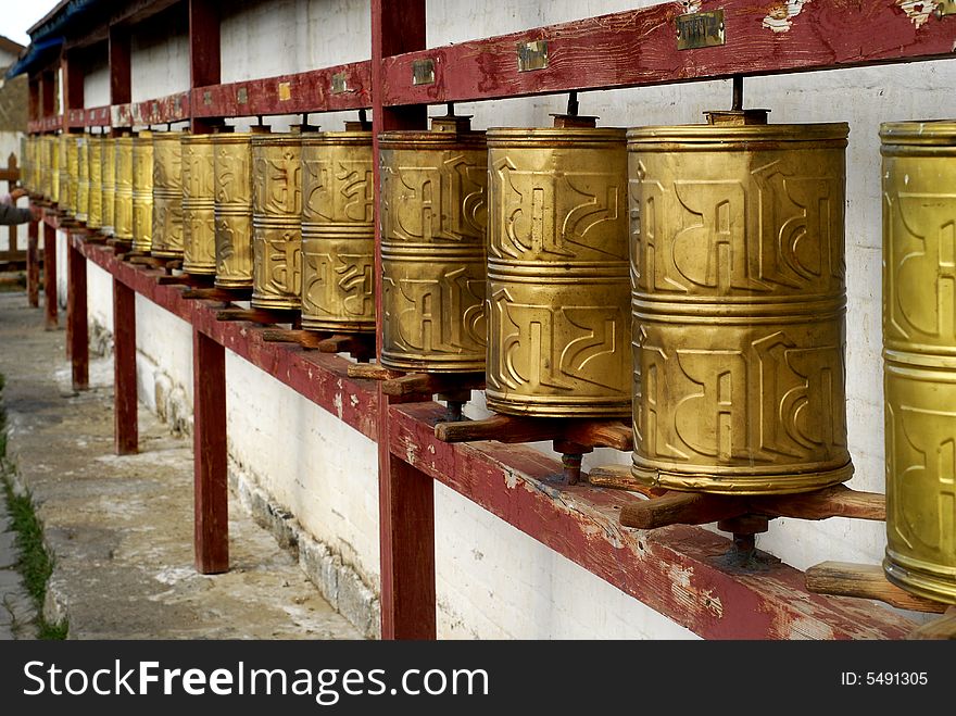 Prayer wheels mounted along the wall of one temple at Erdenzuu Monastery, which is on the site of Genghis Khan's original palace in Kharakorin, Mongolia