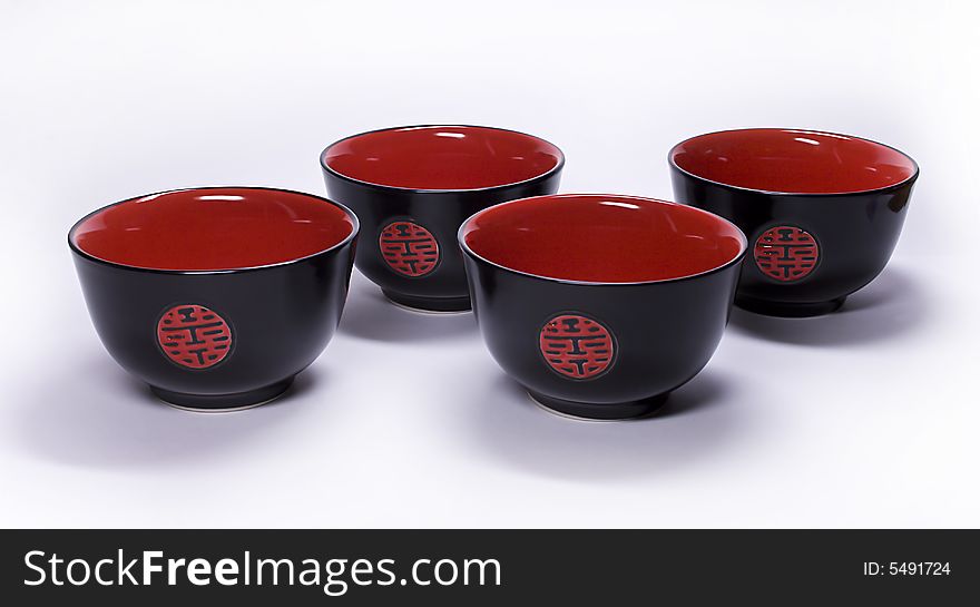 Black clay cups from China on a white background