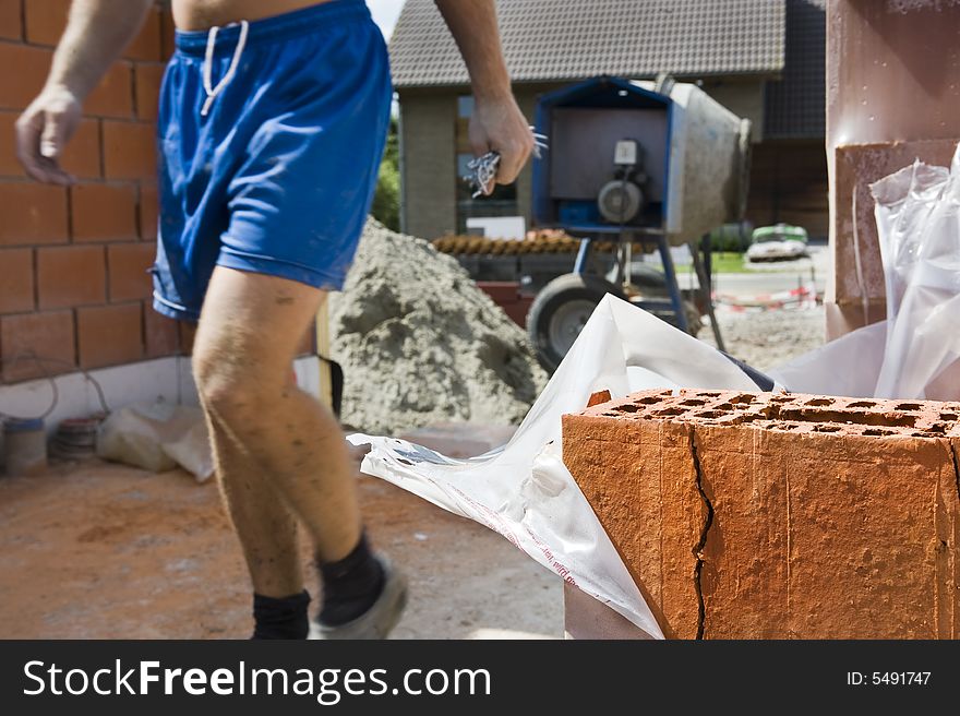 Close up of a brick on a construction site.