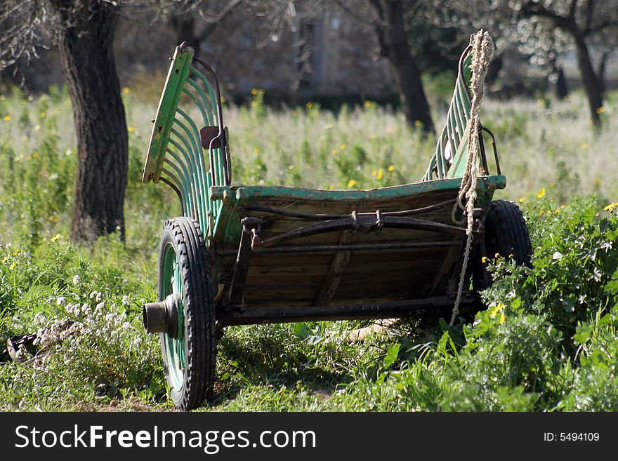 Old waggon in a field waiting for his owner