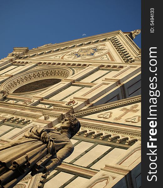 A wonderfull shot of the statue of Dante Alighieri and santa croce church in florence - Italy. A wonderfull shot of the statue of Dante Alighieri and santa croce church in florence - Italy