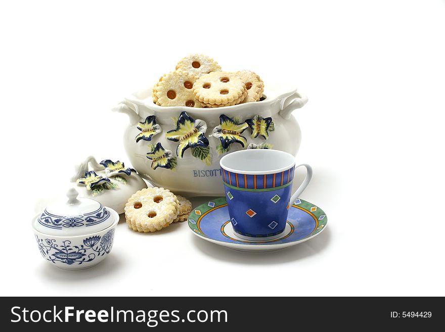 Cookie Jar With Sugar Bin And Blue Cup isolated on white backround.