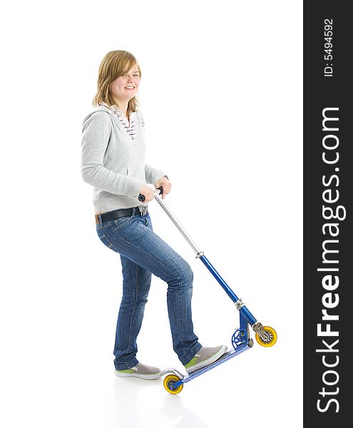 The young beautiful girl with a scooter isolated on a white background