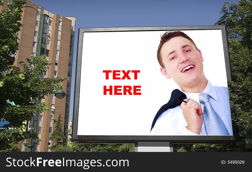 Blank billboard in city and young businessman. Blank billboard in city and young businessman