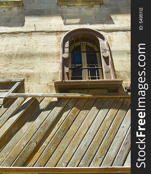 A depilated wooden window in the Silent City