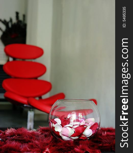 Vase of rose petals on a table in a modern house - home decors.