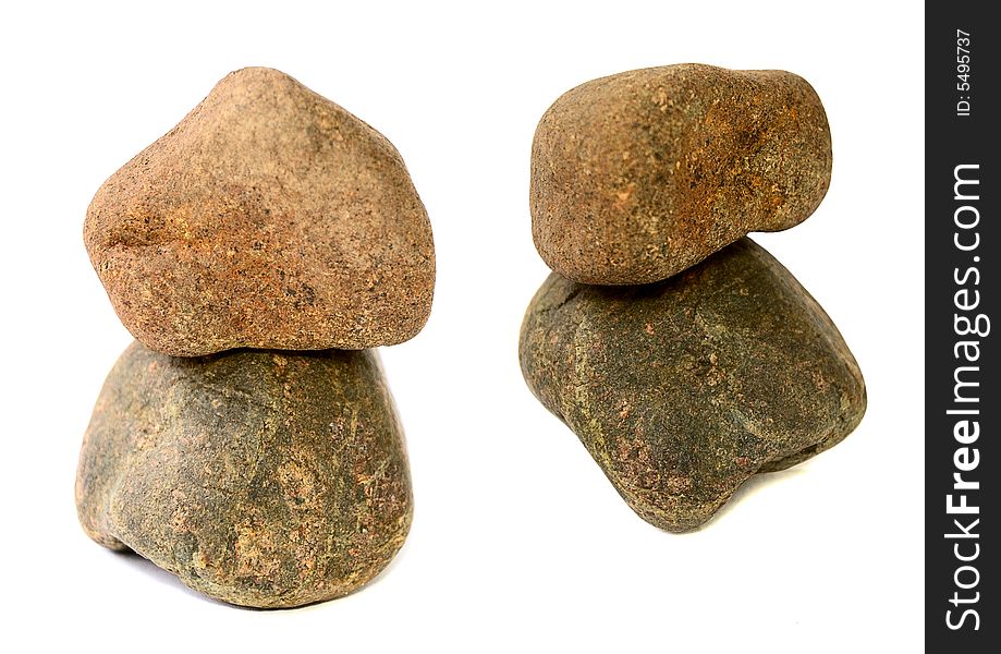 Balance of two stones isolated on white