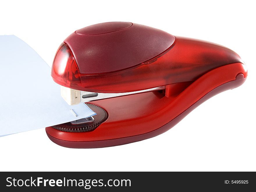 Stapler of red color on a white background