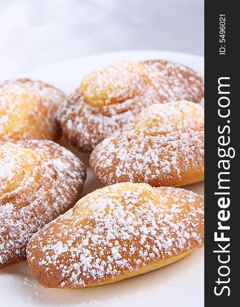 Doughnuts with stuffing and powdered sugar