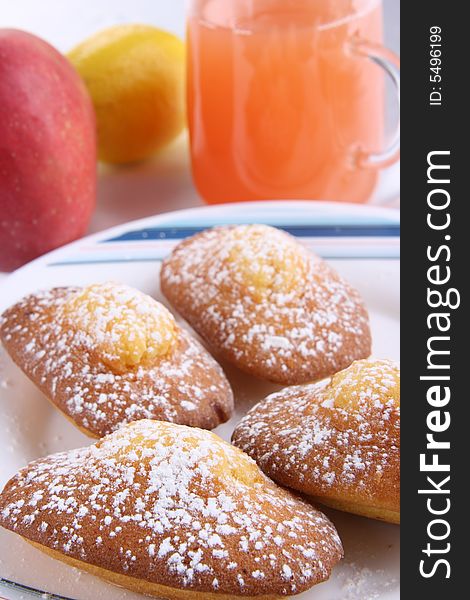 Doughnuts with fruits and powdered on the plate