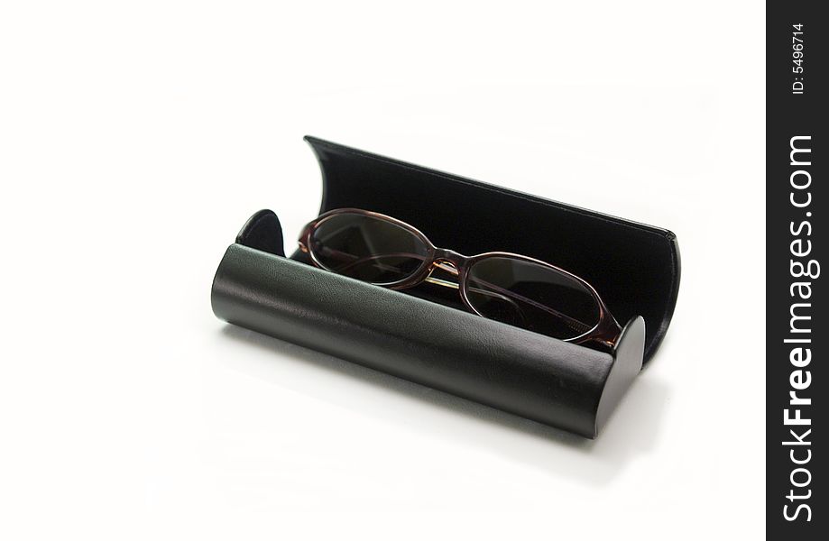 Sunglasses in a box on white background