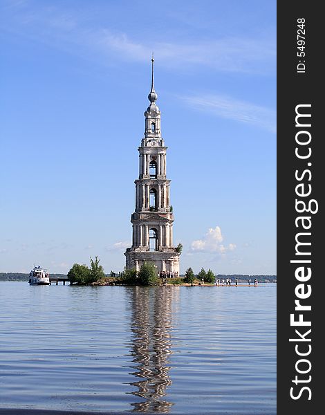 The bell tower among water in summer. The bell tower among water in summer