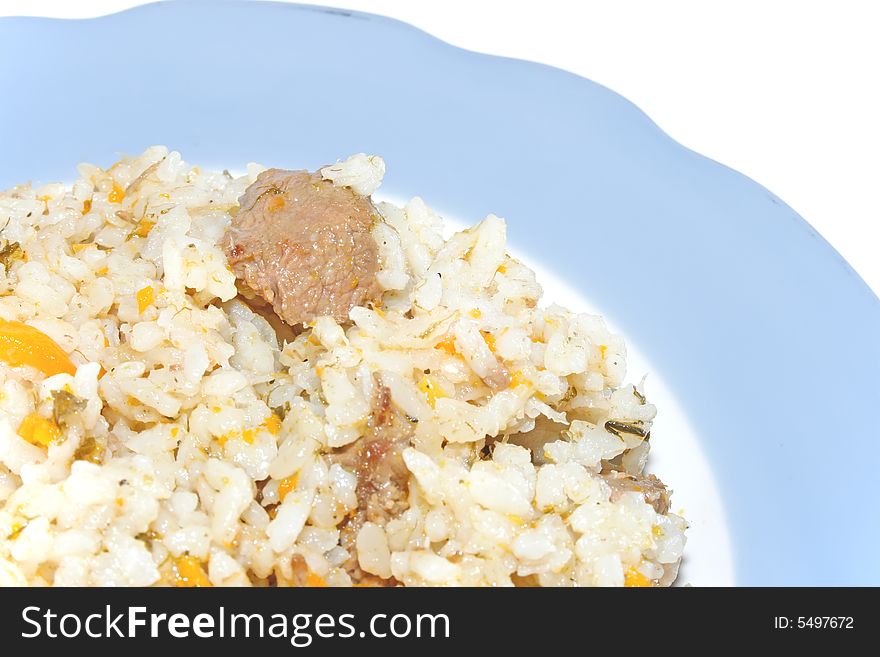 Dish of pilau from rice, meat and vegetables, with spicinesses on a white background. Dish of pilau from rice, meat and vegetables, with spicinesses on a white background