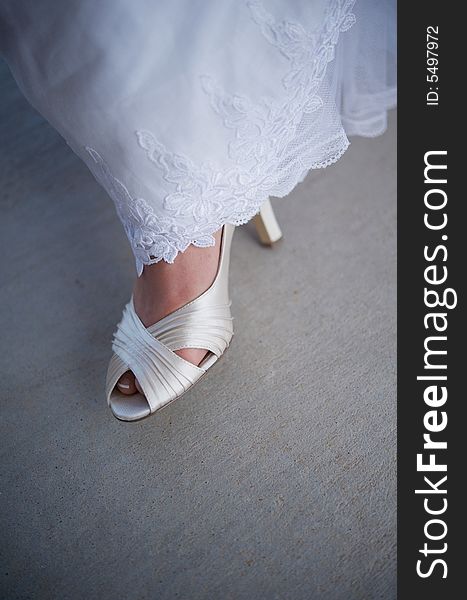 Bride S Formal Shoe Showing From Underneath Gown