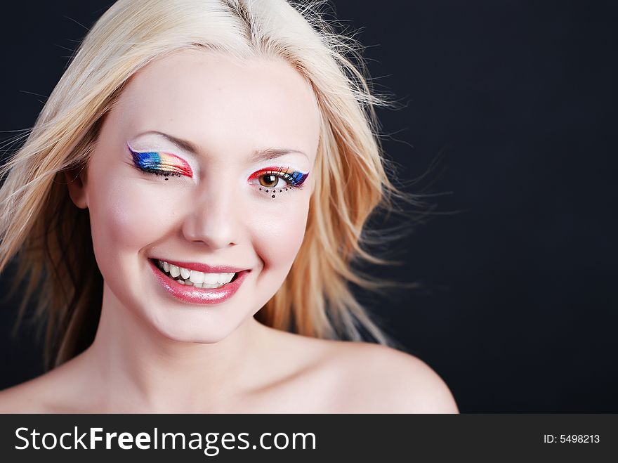 Beautiful young girl with bright make-up and smiling look. Beautiful young girl with bright make-up and smiling look