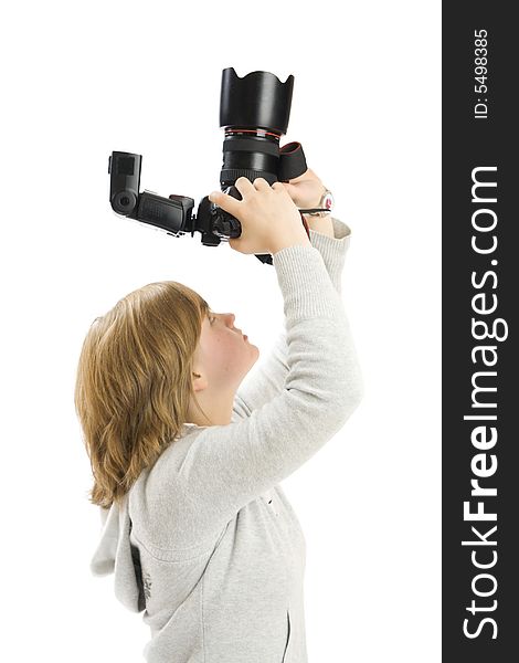 The young beautiful girl with the camera isolated on a white background