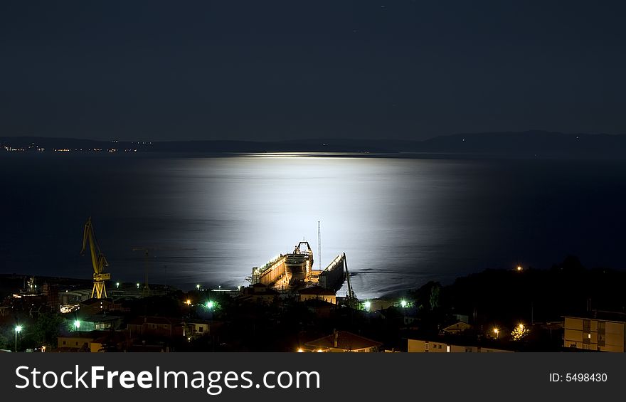 Shipyard dock view in moonlight. Shipyard dock view in moonlight