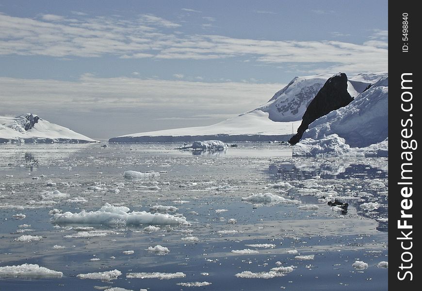 View from the sailing ship Europa on a mountain range in Antarctica , icebergs. View from the sailing ship Europa on a mountain range in Antarctica , icebergs