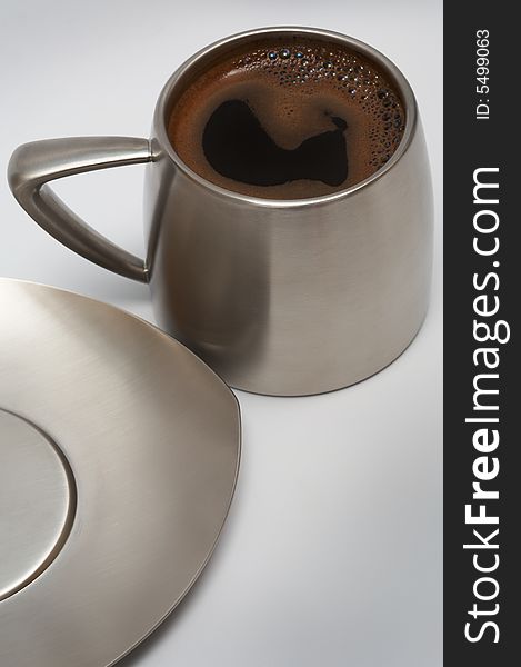 Coffee in a modern metal cup