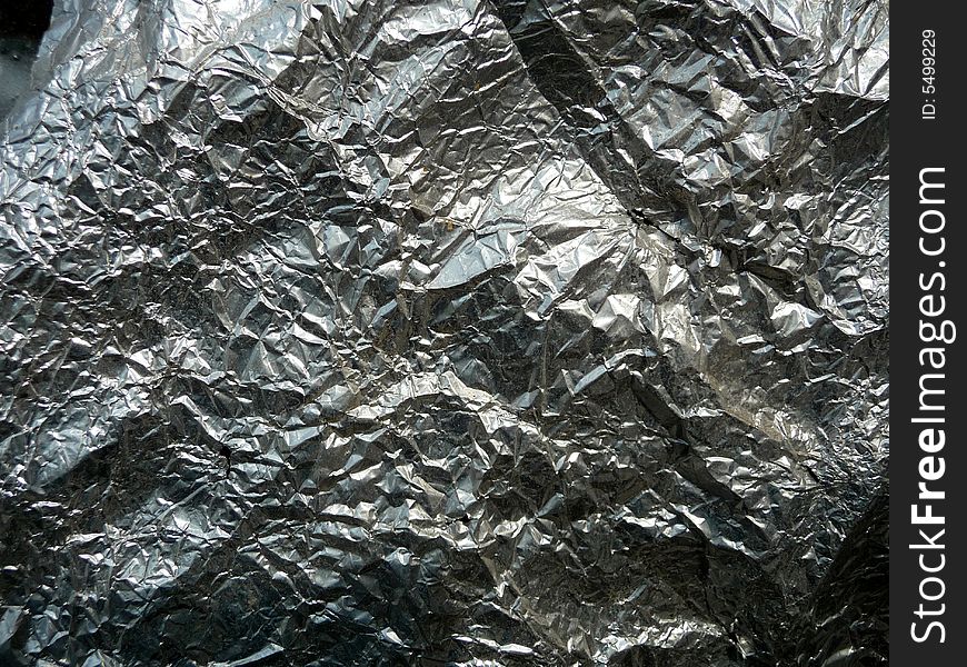 A photograph of some silver foil, it would make a interesting texture background. A photograph of some silver foil, it would make a interesting texture background.