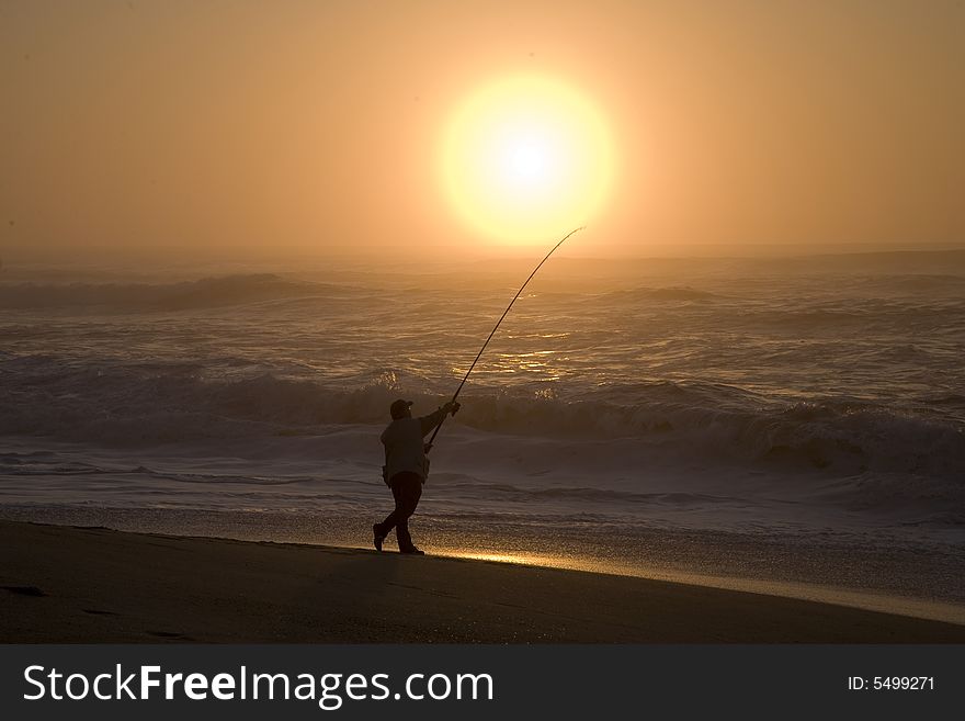 Fisherman In Sunset