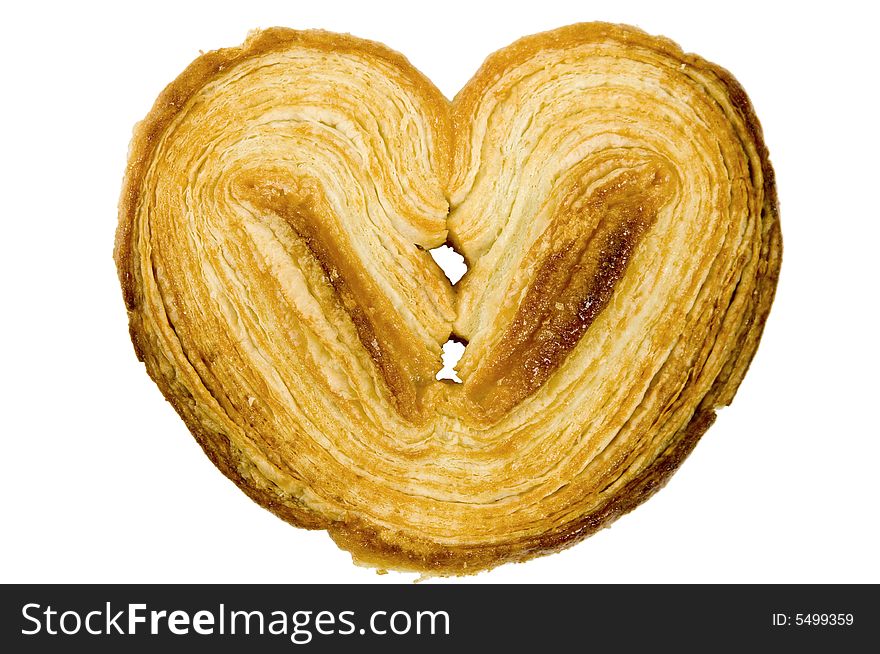 Crispy, delicate puffed heart shaped pastry cookie - isolated on white