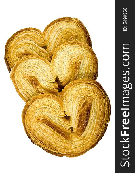 Crispy, delicate puffed heart shaped pastry cookies - isolated on white