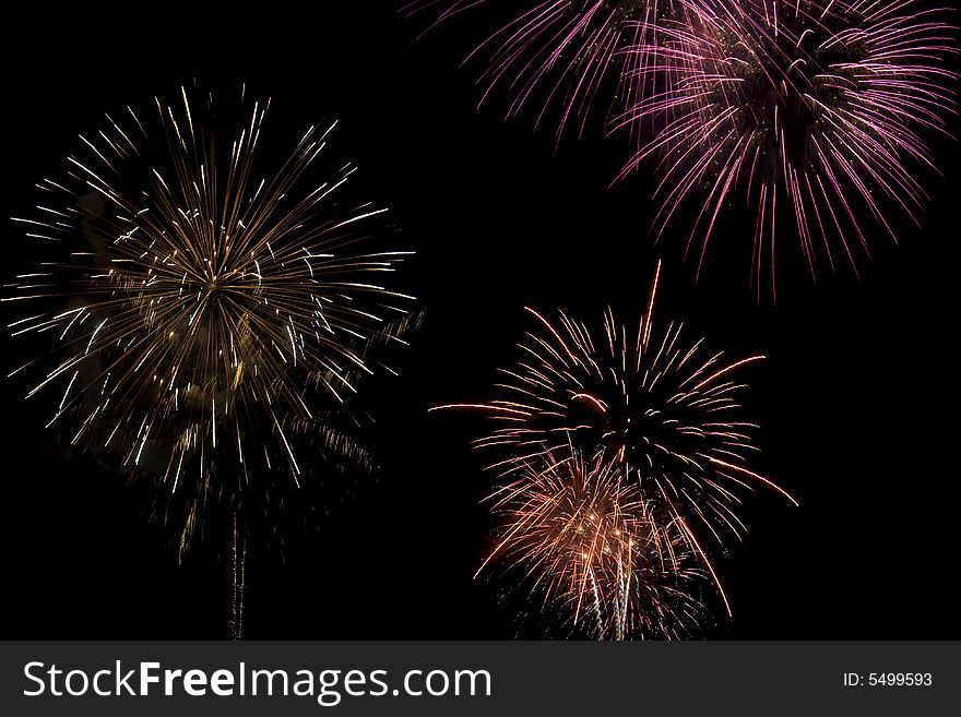 Multiple colors of fireworks exploding in the sky. Multiple colors of fireworks exploding in the sky.