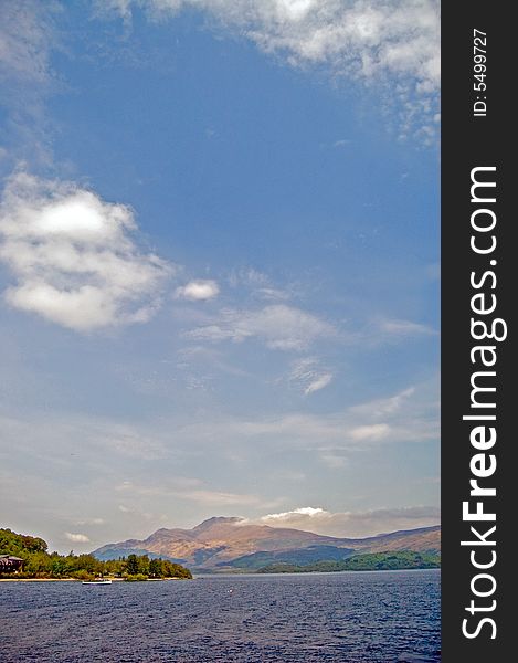 A lovely shot of distant mountains and
loch lomond in scotland. A lovely shot of distant mountains and
loch lomond in scotland