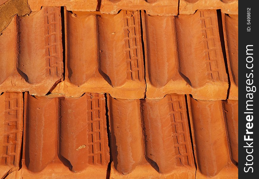 Terracotta clay rooftiles is situ, 30 years old - close up. Terracotta clay rooftiles is situ, 30 years old - close up.